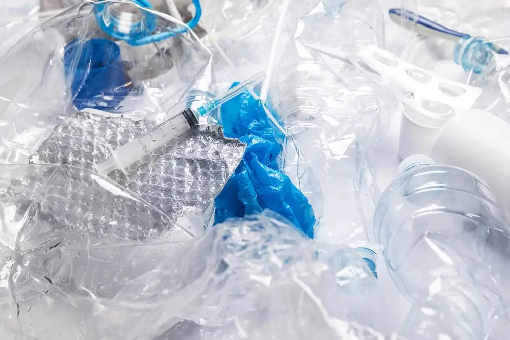 recycled-plastic-bottles-and-syringe-waste-close-u